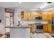 Kitchen featuring wood cabinets, stainless steel appliances, and bar seating at 434 Kings Crown Rd, Breckenridge, CO 80424