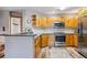 Kitchen featuring wood cabinets, stainless steel appliances, and breakfast bar seating at 434 Kings Crown Rd, Breckenridge, CO 80424