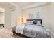 Serene bedroom featuring a plush bed, decorative lighting, and inviting atmosphere at 2100 N Humboldt St # 207, Denver, CO 80205