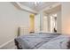 Relaxing bedroom with cozy bedding and an ensuite bathroom at 2100 N Humboldt St # 207, Denver, CO 80205