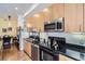 Well-equipped kitchen boasting stainless steel appliances and ample cabinet space at 2100 N Humboldt St # 207, Denver, CO 80205