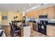 Open kitchen featuring stainless steel appliances and a functional island with breakfast bar at 2100 N Humboldt St # 207, Denver, CO 80205