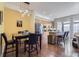 Open-concept kitchen with modern cabinets, stainless steel appliances, and island seating at 2100 N Humboldt St # 207, Denver, CO 80205