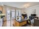 Bright living room with fireplace and large windows letting in plenty of natural light at 2100 N Humboldt St # 207, Denver, CO 80205
