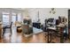 Bright living room featuring a fireplace, hardwood floors, and contemporary decor with ample natural light at 2100 N Humboldt St # 207, Denver, CO 80205