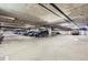 Wide angle shot of parking garage showcasing multiple cars and multiple parking spaces at 2100 N Humboldt St # 207, Denver, CO 80205