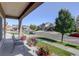 Landscaped front yard and porch with seating at 10777 Wheeling Dr, Commerce City, CO 80022