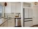 Kitchen area features stainless steel dishwasher, granite countertops, tile backsplash, and modern appliances at 10777 Wheeling Dr, Commerce City, CO 80022