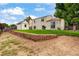 Large backyard with retaining wall, shed, lots of shade and sliding glass door access at 5101 E 122Nd Cir, Thornton, CO 80241