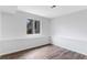Spacious bedroom features wood-look floors, neutral paint, a large window and natural light at 5101 E 122Nd Cir, Thornton, CO 80241