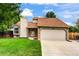 Charming single-Gathering home with a manicured lawn, two-car garage, and stone accents at 5101 E 122Nd Cir, Thornton, CO 80241