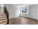 Finished basement with wood-look floors, natural light, and access to the staircase at 5101 E 122Nd Cir, Thornton, CO 80241