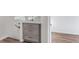 Hallway featuring wood-look floors and built in cabinets with modern hardware at 5101 E 122Nd Cir, Thornton, CO 80241