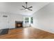 Living room featuring a modern ceiling fan and a cozy fireplace at 5101 E 122Nd Cir, Thornton, CO 80241