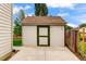 Large backyard storage shed with solid door, level concrete pad and easy backyard access at 5101 E 122Nd Cir, Thornton, CO 80241