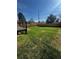 Expansive back yard featuring a lush lawn and wooden perimeter fencing at 6494 Magnolia St, Commerce City, CO 80022