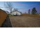 This home has a spacious back yard, wood fencing, and a back patio at 6494 Magnolia St, Commerce City, CO 80022