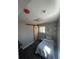 Cozy bedroom features a barn door, gray walls, modern lighting, and plush carpet flooring at 6494 Magnolia St, Commerce City, CO 80022