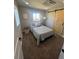 This spacious bedroom offers natural light, neutral decor, and a stylish barn door at 6494 Magnolia St, Commerce City, CO 80022