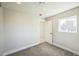 Bright bedroom with plush carpet, white trim, and plenty of natural light at 6494 Magnolia St, Commerce City, CO 80022