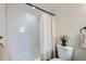 Bright bathroom featuring a tiled tub, modern fixtures, and fresh decorations at 5147 Saint Paul St, Denver, CO 80216