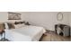 Comfortable bedroom with a plush bed, neutral color scheme, and a decorative rug at 5147 Saint Paul St, Denver, CO 80216