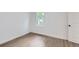 Bright bedroom with hardwood floors, crisp white walls, and natural light at 5147 Saint Paul St, Denver, CO 80216