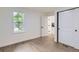 Bedroom featuring a closet, white walls, hardwood floors, and natural light at 5147 Saint Paul St, Denver, CO 80216