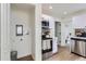 Efficient kitchen with modern appliances and bright white cabinetry at 5147 Saint Paul St, Denver, CO 80216