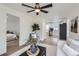 Open-concept living room showing view into the bedroom, bathroom and kitchen at 5147 Saint Paul St, Denver, CO 80216