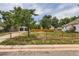Wide angle shot shows large yard, new privacy fence, detached garage, and main home at 5147 Saint Paul St, Denver, CO 80216