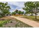 Driveway shot shows the detached garage, new privacy fence, and main home at 5147 Saint Paul St, Denver, CO 80216