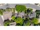 Expansive aerial perspective showcases a home nestled among mature trees in a well-established neighborhood at 10886 E Crestline Cir, Englewood, CO 80111