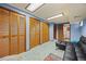 Spacious basement featuring carpet flooring, ample storage, and a comfortable seating area at 10886 E Crestline Cir, Englewood, CO 80111
