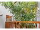 Grand foyer with a lush indoor tree creating a refreshing, natural ambiance at 10886 E Crestline Cir, Englewood, CO 80111