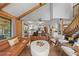 Open-concept living room flowing into a modern kitchen with a large island and stainless steel appliances at 10886 E Crestline Cir, Englewood, CO 80111