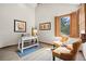 Bright home office with hardwood floors, shuttered windows, and stylish decor at 10886 E Crestline Cir, Englewood, CO 80111