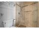 Bathroom with glass enclosed shower with tiled walls and decorative accents at 10886 E Crestline Cir, Englewood, CO 80111
