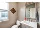 Half-bathroom featuring neutral tones, patterned backsplash, and classic design at 3685 Roberts St, Mead, CO 80542