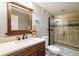 Modern bathroom featuring updated vanity, a granite countertop and a glass enclosed shower at 3685 Roberts St, Mead, CO 80542