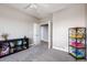 Bedroom featuring a bookshelf, carpet flooring and neutral paint at 3685 Roberts St, Mead, CO 80542