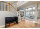 Grand foyer with staircase and open floor plan flowing into the living room at 3685 Roberts St, Mead, CO 80542