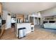 Bright open living area with hardwood floors, flowing into a modern kitchen and high-ceiling living room at 3685 Roberts St, Mead, CO 80542