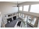 Spacious living room boasting high ceilings, a fireplace, and large windows for ample natural light and beautiful views at 3685 Roberts St, Mead, CO 80542