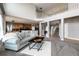 Open-concept living room with large windows, hardwood floors, and neutral décor at 3685 Roberts St, Mead, CO 80542