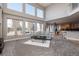 Spacious living room with fireplace, large windows, and a comfortable sofa at 3685 Roberts St, Mead, CO 80542