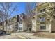Attractive exterior of a multi-unit building with landscaping and parking at 2225 S Jasmine St # 304, Denver, CO 80222