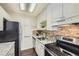 Well-equipped kitchen with granite countertops and modern appliances at 2225 S Jasmine St # 304, Denver, CO 80222