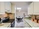 Kitchen features granite countertops, modern appliances, and open concept design at 2225 S Jasmine St # 304, Denver, CO 80222