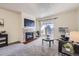 Living room features a fireplace, balcony access, and ample natural light at 2225 S Jasmine St # 304, Denver, CO 80222